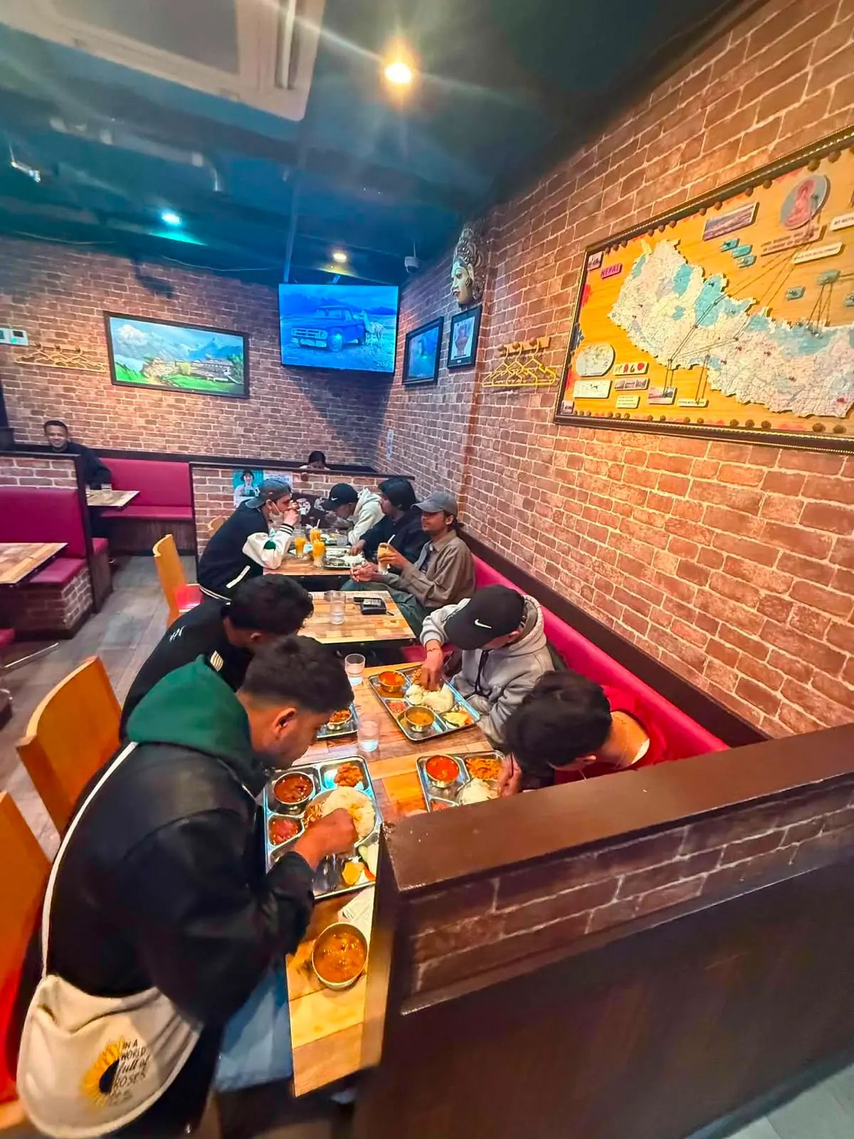 Residents sharing a Nepali meal together at a restaurant in Tokyo